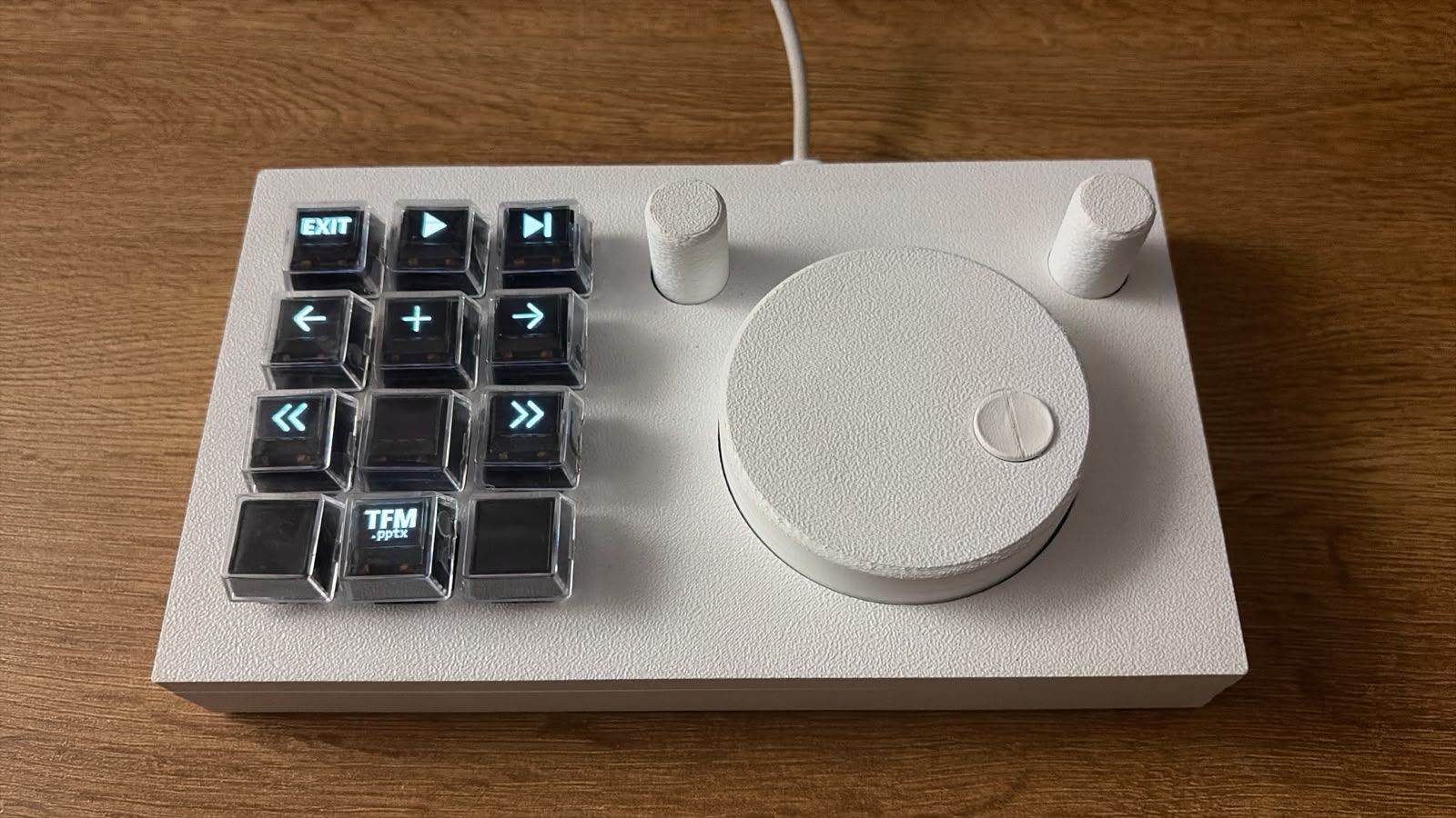 ORVY on a desk showing presentation controls on its keys.